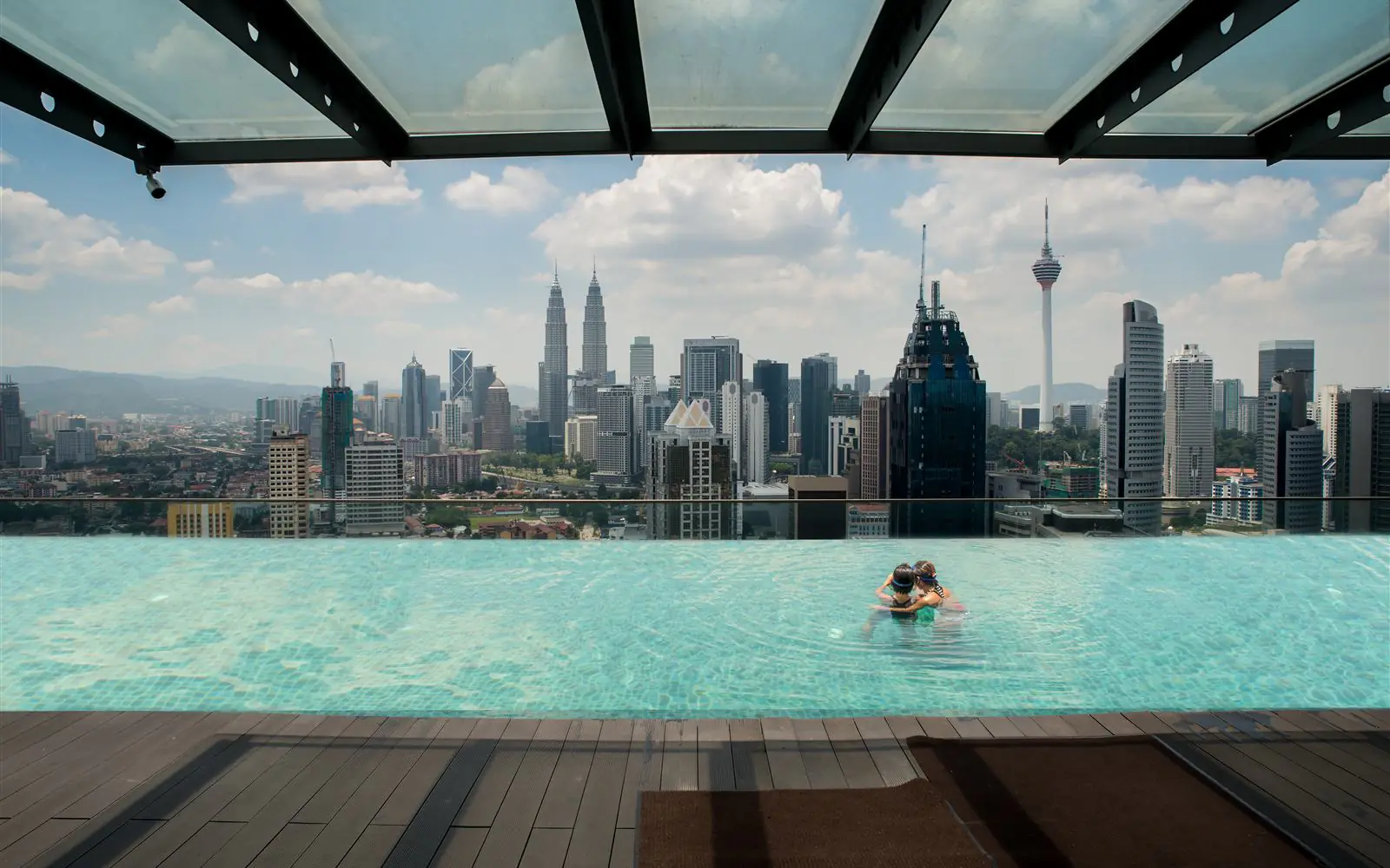 City pool and destination skyline